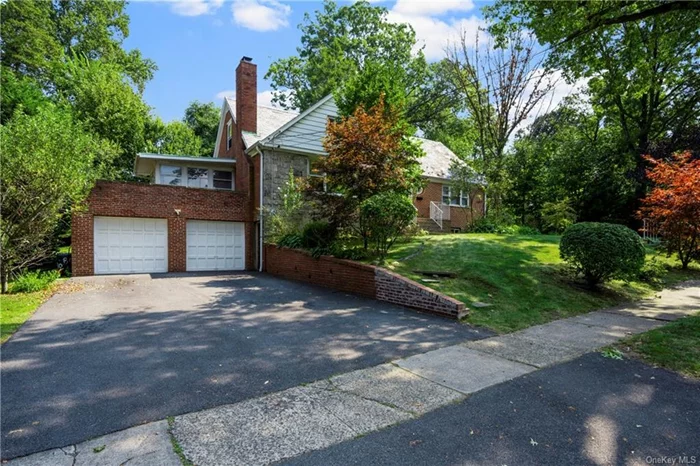 The best deal in Pelham! Spacious expanded Cape Cod home sits on a 1/4 acre corner lot in Pelham Manor just off the Esplanade. Endless space on 3 floors perfect for any size household plus au pair/guests/extended family. Gorgeous hardwood floors throughout and large picture windows drench the home with natural light. On the first floor, the living room, dining room, heated sunroom and dine in kitchen (with moveable island) all flow easily from one to next. In addition, there are 2 full bathrooms and 2 bedrooms on the first floor, including the main bedroom suite with a walk in closet and its own full bath. Upstairs there are 3 more bedrooms, one with a giant adjoining closet room , the other would be a perfect office or nursery, and the 5th bedroom is spacious and bright, plus a hall bathroom. Bring your decorator and make this house spectacular! Need lots of storage? There is generous storage space on the second floor and basement. In fact, the basement alone boasts an additional 1, 254 sf legally finished space with a separate entrance, laundry and a 4th full bath, plus a door which opens to the adjoining two car garage. The wide driveway will fit an additional 4 cars. This perfect Pelham Manor location is walking distance to all Pelham schools, the K-5 Siwanoy elementary and Pelham Middle School and Pelham High School. By the way, this property features healthy apple and pears trees that you can harvest and enjoy. Finally, as a Pelham manor resident, you can use the water front Shore Park every day of the year.