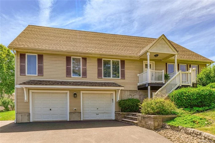 CHARMING GOSHEN CAPE - Delightfully situated within the historic Village of Goshen and walkable to cafes, shops and restaurants yet offers a peaceful natural feeling with privacy. One of the most striking features of this well built home includes an open floor plan with soaring cathedral ceilings punctuated with large windows overlooking a meadow. The expansive rear deck with awning facing pristine landscaping up close and a forest in the back. You get a little bit of everything as far as atmosphere. The absolutely pristine top notch interior offers an exceptionally well designed kitchen and 3 full baths. An ample first floor primary bedroom offers a huge walk in closet and its own bath. A second bedroom on the first also has its own bath. Upstairs, the second floor offers a suite with third bedroom, full bath, sitting area and loft space ideal for an office. The lower level offers an ample garage, mud room and huge storage room. Everything about this ideal home exudes low maintenance and comfort. Municipal services, minutes to schools and has room for a pool. Minutes to major highways and public transportation and less than 60 miles to NYC.