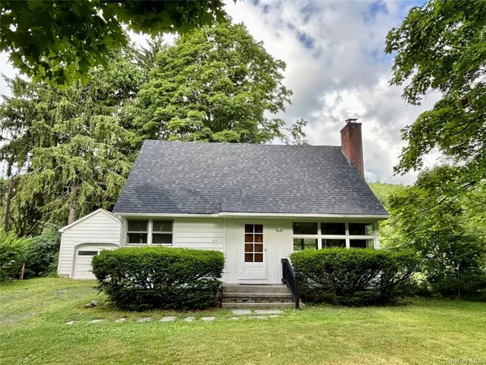 This is a fantastic two or three-bedroom home featuring newly refinished hardwood floors throughout. The large living area includes a wood-burning fireplace and expansive windows that open to the front yard. A versatile study/office on the first floor could easily serve as an additional bedroom. The two spacious and bright bedrooms upstairs are complemented by a newly renovated full bathroom. The home also boasts a level backyard and a garage, ideal for storage or use as a workshop. Situated on a quiet back road in a charming residential area, this property offers close proximity to all the amenities of Amenia, the Harlem Valley Rail Trail, Four Brothers Drive-in Theatre, and convenient access to the Wassaic train station, providing a direct route to NYC in just a few hours.