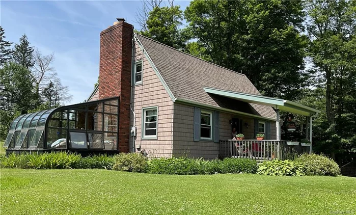 Nestled on a serene country road in Sullivan County, New York, sits this charming three-bedroom, 2 bath Cape Cod-style home on a picturesque one-acre lot. If privacy is what your looking for, then this is it. Home features stone fireplace with wooestove insert, hard wood floors, walk out basemant and an amazing solarium to be enjoyed for all seasons. This tranquil retreat offers a detached garage with plenty of storage. The well maintained lawn and mature landscaping, with a large vegetable garden is a gardener&rsquo;s delight. Minutes away from Downtown Liberty, New York. Easy access to Bethel Woods Performing Arts Center and The Delaware River.