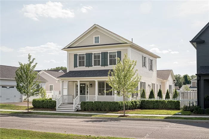 This Oxford New England style home in Tradition at Red Hook, was completed in 2021 and features over 2, 000 sf of living space, 3 bedrooms, 2.5 baths, an attached 2-car garage and a fully fenced in side yard. The handsome home has a full length front porch, entry foyer, open kitchen, dining room and living room layout. The primary suite located on the main level has stunning French tapestry mural paper from Pierre Frey, two walk in custom closets and an en-suite bath with an upgraded Waterworks sink faucet. The second level has a generous den sitting area with custom built in, floor to ceiling bookshelves, 2 bedrooms and a full bath. There are custom window treatments throughout the home. Luxury washer & dryer, whole house Generac generator and security system included. Full basement is carpeted and provides plenty of room for storage. Extensive landscaping including mature boxwoods surround the home. Municipal water & sewer. This Traditional Neighborhood Development (TDN) offers a walkable, front porch lifestyle with driveways tucked behind the homes. Grounds maintenance is through a homeowner&rsquo;s association and amenities include a Clubhouse, pool and pet area. Located just south of Red Hook Village, walking distance to the Lyceum movie theater, Holy Cow ice cream & Mighty Donuts.