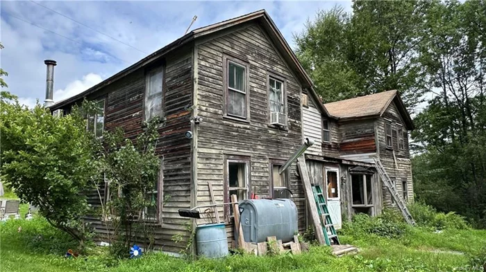 Fixer-Upper Opportunity in Swan Lake, NY nestled on 7 acres of picturesque land in the agricultural conservation district which allows 1 house per 10 acres, this property in Swan Lake presents a unique investment opportunity. The house, barns, and outbuildings are in poor condition and in need of extensive renovation. Despite the current state, this property offers much potential. Please note that the property is being sold as-is, with no representation of any of the systems. Potential buyers are advised to take proper safety precautions when exploring the site. Bring your vision and restore this property back to its former glory. NO VISITS WITHOUT AN APPOINTMENT AS THAT WILL BE CONSIDERED TRESSPASSING. Appliances not included.