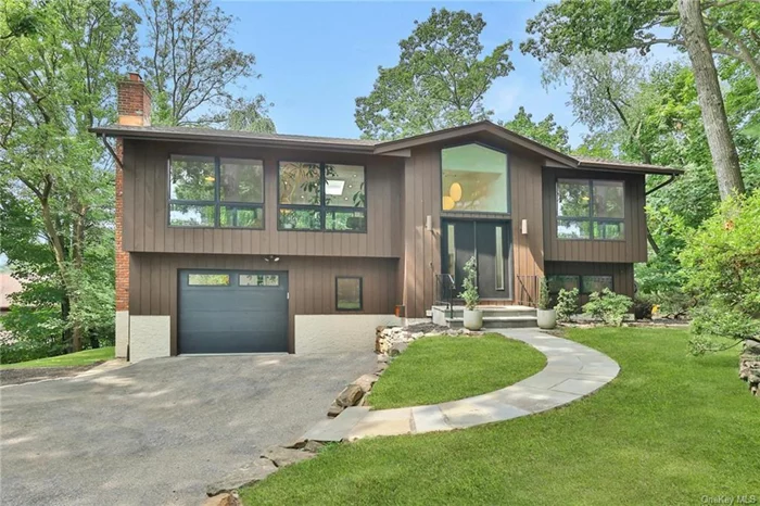 Perched high in the hills and tucked away at the end of the road, offering a serene country-like setting, you will find this sophisticated Contemporary Raised Ranch... no expense was spared, or detail missed, in redesigning/renovating this immaculate home two short years ago. The entire home was modernized to incorporate today&rsquo;s living and work from home needs, with a focus on an energy-efficient building envelope e.g., windows, doors, insulation, and roof combined with Geothermal heating/cooling and new appliances resulting in an extremely low utility (electric/gas) cost averaging only $268 per month. The main level open concept floor plan features a vaulted ceiling, walls of windows, and a skylight creating a seamless connection with the outdoors. Within the interior space, you will find a Bilotta custom kitchen with Thermador appliances, honed granite countertops with waterfall edges, and a large center island. The living room with wood burning fireplace offers a separate reading nook. And the dining area provides access to the large, elevated deck overlooking the expansive multi-tiered backyard. Back inside, head down the hallway off the main living area and you will find the primary bedroom and primary bathroom, plus an office (or 4th bedroom). Downstairs offers two additional bedrooms (one currently used as a den), a full hall bathroom, workshop, laundry room and direct access to the climate-controlled garage (currently used as an art studio). Additionally, this level provides access to a ground-level deck and the backyard. With an additional lot, this property sits on a combined .54 acres and offers a private backyard oasis that you will enjoy throughout the seasons. Uniquely, this property is located in the Village of Dobbs Ferry and with the choice of Ardsley or Dobbs Ferry schools. Dobbs Ferry is one of the Rivertowns most accessible villages and has much to offer: Hiking trails in the nearby Juhring Nature Preserve, Gould Park and Pool, Dobbs Ferry&rsquo;s Waterfront Park, nearby South County Trail, easy access to parkways/highways, parking at the Dobbs Ferry Metro-North Train Station, and plenty of local shops and restaurants.