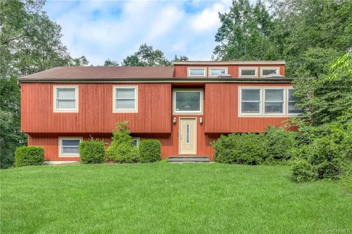 Marvelous contemporary raised ranch in lovely Pomona NY. Sitting pretty on over an acre of gorgeous flat land with lots of privacy behind trees and greenery, at the end of quiet cul-de-sac road. With 2, 484 SqFt of living space, enter through foyer into sunny living room built under cathedral ceilings with all new windows, skylights, and gleaming hardwood floors throughout. Dine in the formal dining room leading into updated eat-in kitchen equipped with fresh white cabinets, stainless steel appliances, granite countertops, and breakfast bar. Sliding door walk-out to Trex deck with retractable awning, overlooking the gorgeous and private backyard. Relax in the park-like property with patio and young salt-water, gunite pool. Large main bathroom with redone tub along with laundry area and 3 spacious bedrooms make up the main floor. Primary suite with walk-in closet and updated primary bath with standing shower. Lower-level boast recreation room with wood-burning fireplace and walk out to backyard. Additional bedroom and powder room for guests. Other amenities to this home are the two-car garage with automatic doors, baseboard heat (3 zones), central air conditioning, young water heater, pull stair attic for storage, and more. Come make this home today!