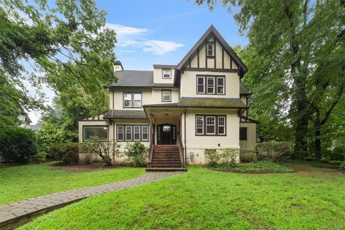 11 Brookside Circle, Bronxville, NY. Step into this bright and welcoming Tudor, ideally located just steps from Bronxville Village shops, restaurants, and Metro North. Long-term tenants recently vacated, so a full refresh is underway! Upon move-in you will find it freshly painted, with newly refinished hardwood floors throughout, some updated electric and plumbing. This home exudes charm and elegance.  Entertain guests effortlessly in the sunlit living room with a cozy fireplace that opens up to the inviting patio and expansive yard. The first floor also features a powder room, formal dining room, and a spacious eat-in kitchen.  The 2nd level boasts a primary bedroom with an ensuite bath, 2nd bedroom, and 3rd bedroom with an ensuite bath that also opens to the hallway. The 3rd level offers easy-access attic storage with a cedar closet, a hall bathroom, and a 4th bedroom that could also be the perfect home office space.  The lower level includes an expansive storage area and a convenient washer/dryer setup. This Tudor home combines classic beauty with modern comforts, making it a must-see!