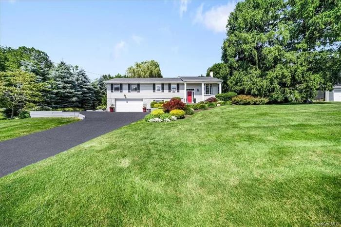 Pride of ownership is evident throughout this beautifully expanded updated home. The bluestone walkway welcomes you to the front porch with scenic views. The open floor plan offers an effortless flow from spacious living room with large bay window to updated kitchen with granite counters and stainless appliances, dining room with sliding door out to large deck with steel see-through railing overlooking beautiful backyard oasis that continues to the above ground pool and so much more creating an inviting atmosphere perfect for everyday living and entertaining. The main level also offers a primary bedroom with vaulted ceiling, skylight, two custom walk-in closets and spa-like bathroom with separate tub, walk-in shower and skylight. Three additional bedrooms and updated hall bath complete the main level. The open lower level is a perfect blend of a spacious family room with wood burning stove and built-ins, powder room, laundry/fitness/home office and access to two car garage. This beautiful home with tasteful updates is located just minutes to shops, restaurants, schools, parks and recreation, bike trails, golf and parkways!