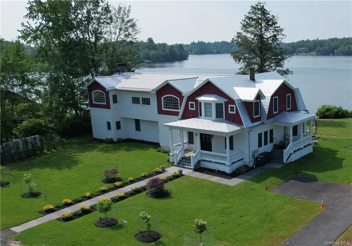 Spectacular waterfront estate! This elegant lake front home and guest house sit majestically on the shores of one of the most sought-after lakes in the Sullivan County Catskills. Exquisite family compound boasts unsurpassed attention to every detail. With noticeable upscale custom finishes throughout, the owner maintained architectural integrity while adding all the modern luxuries and estate-quality enhancements in the huge addition resulting in 9 beautiful bedrooms, 6.5 luxurious baths, two fireplaces, and perfectly appointed living and entertaining spaces which lead to stunning outdoor areas. Sweeping lake views can be enjoyed from nearly every room in the home, there are verandas from most bedrooms and access to enormous deck from kitchen, dining and living rooms. Premium choice materials and features are just too many to mention (see list in docs) but include custom imported doors and wide plank flooring as well as stunning textured natural stone on the massive waterfall Island. Thoughtfully selected appliances are mainly Sub-Zero: wine cooler, 2 refrigerators, 2 dish washers, Wolf professional stove, refrigerator drawers, ice maker, microwave drawer in kitchen; towel warmers, heated exhaust fans and Toto comfort toilets in almost every bath. Radiant heat, solar electric, whole house fresh air system, extensive alarm system, central air and audio, central vac and more! A detached garage with 5 bays offers guest quarters with a 3 bedroom, 2 bath apartment above (total count SF, BR&rsquo;s BA&rsquo;s in listing) and plenty of room to expand. Parking in lot/ driveway and garage for many cars. Crystal clear Kauneonga Lake if known for its sunsets, sparkling waters, swimming, fishing and motorboating. Bethel Woods is moments away and dining on the lake can be accessed by boat or short drive around the corner. Two plus lakefront acres of bliss; welcome to your Grand Country Manor dream come true!