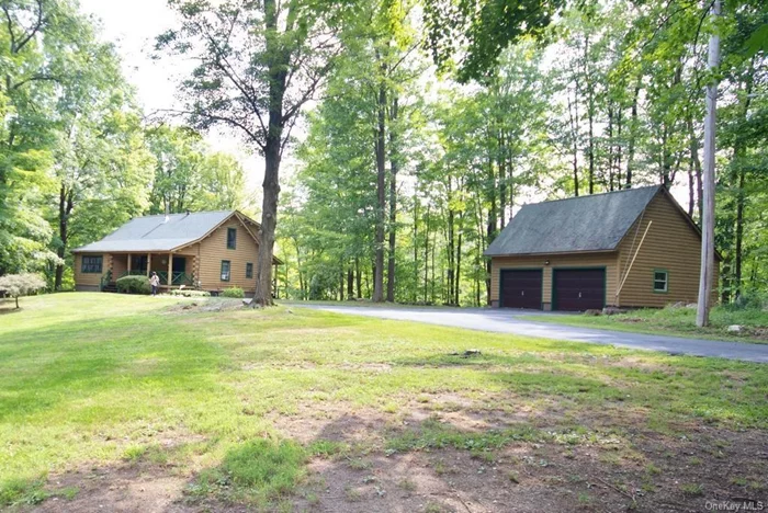 Welcome to this beautiful two-bedroom, two-full-bathroom log cabin home, a perfect blend of rustic charm and modern comfort. The first floor offers an open-concept kitchen, living room, and dining area combo with big, high ceilings, creating a spacious and inviting atmosphere. The living room features a cozy wood-burning stove, perfect for chilly evenings. Also on the first floor, you&rsquo;ll find one bedroom and one full bathroom for your convenience. Upstairs, the home boasts a large open loft area, one spacious bedroom and one full bathroom, providing a versatile space that can be customized to suit your needs. The partially finished walkout basement features a family room with a bar, ample closets, adding an ideal spot for entertaining guests. Outside, you&rsquo;ll be greeted by a beautiful new paved walkway that enhances the home&rsquo;s curb appeal. The property is adorned with mature trees and meticulously maintained landscaping, offering a serene and picturesque setting. A detached log two-car log garage provides ample storage and convenience. Located at the end of the street, this house offers unparalleled privacy, sitting on a generous 2.1-acre lot. The home is exceptionally well-maintained, has had may recentl upgrades and requires no work, making it move-in ready for its next fortunate owner. Don&rsquo;t miss the opportunity to own this private oasis. Located 3 min to Otisville train station, close to hiking, fishing and wineries. 15 minutes to all major highways , Garnett Medical Center and shopping