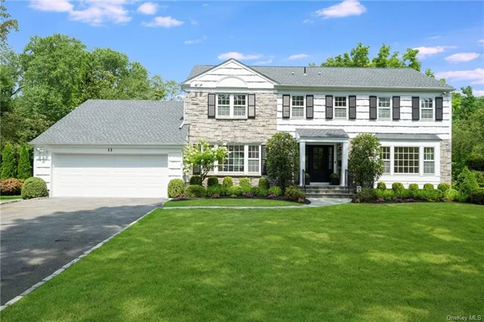 This remarkable renovation of a 1960s Center Hall Colonial with designer high end finishes is a rare unique offering. On a level .49 of an acre in the heart of Heathcote, this home is steps away from Scarsdale Middle School. Fully renovated, this 4, 300 square feet, 5 bedrooms, 4 full baths, 2 half bathrooms, home office and expansive basement. Impeccably designed and with no detail overlooked, the bespoke indoor finishes include European Oak wide plank floors, recessed and custom lighting, new door hardware throughout, custom steel railing, Brand new HVAC (2 zones), plastered and lime washed fireplace with carbon black granite top, custom bar built in with wine fridge (plus additional storage), custom closets installed throughout, mudroom with porcelain floors and custom millwork. The spacious beautiful kitchen has custom cabinetry floor to ceiling, high end new appliances (including Wolf range and Miele dishwasher), wood island with 36 stainless steel sink, imported Italian porcelain countertops, a zellige tile backsplash, custom lime washed walls & hood along with aged brass hardware. On the second floor, the home has a laundry room with double stacked LG washer dryers, 4 bedrooms, radiant flooring throughout bathrooms and a primary suite that feels like a visit to a 5-star hotel. Beyond all of that, the exterior boasts a brand new roof, spectacular new front door (with Baldwin hardware), exterior columns, custom trim and mailbox. Immediate occupancy for this spectacular move in ready home!