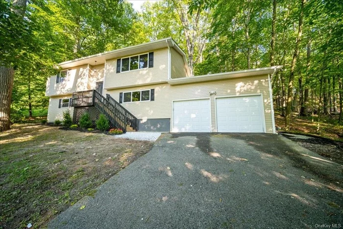 Welcome to 63 Pickerel road! Bilevel nested in a peaceful and quiet neighborhood. This freshly painted home features 4 generously sized bedrooms, 2 full bathrooms, and beautiful hardwood flooring on the upper level. This home has a 2 car garage, a large living room with natural lighting. The dining area is flooded with natural light and has convenient access to the walkout deck. Located in the sought-after Monroe-Woodbury CSD, close to parks, shops, restaurants, and multiple modes of transportation. Move in ready!