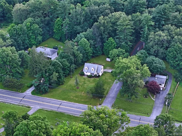 Step into this recently updated Cape Cod residence, situated in the delightful Wallkill area and within the Pine Bush School jurisdiction. The ground level welcomes you with an entrance hall, leading to a separate dining area, a comfy lounge, a snug den, a powder room, a kitchen with space for casual dining, and a radiant sunroom with views of the secluded garden. The upper level houses a large main bedroom, which has been refurbished with a keen eye for design. Further along the corridor, there are three more roomy bedrooms and a shared bathroom. The property&rsquo;s location is ideal for those who commute, being just 60 minutes from the heart of New York City and a stone&rsquo;s throw from key routes such as the 17, 84, and 87, as well as public transport links to the city. For leisure and shopping, the Resort World Casino, Lego Land, local vineyards, major retail outlets, and the Crystal Run Galleria Mall are all easily accessible. This Cape Cod residence offers the perfect mix of style, practicality, and location.