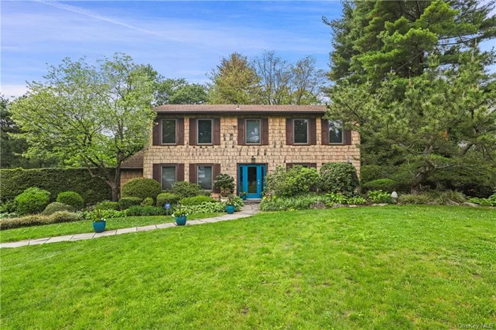 Spacious and airy this 4 bedroom 2.5 bathroom colonial home located on .42 acre in the coveted Country Ridge section of Rye Brook is a must see. As you enter the home you feel right at home as the inviting foyer welcomes you in. Each room is oversized and flows effortless into one another. Large windows throughout the home make this home feel bright and fresh. The eat in kitchen opens nicely into the living room with sliders that take you to the bluestone patio and large backyard. The formal dining room, powder room and laundry room finish the first floor. A few steps up you will find an expansive family room which serves as a comfortable and versatile room. Upstairs you will find 4 large bedrooms and 2 full bathrooms. The primary suite has a renovated bathroom and large walk in closet. The lower level has a very large 2 car garage and additional square footage used as a recreation room which makes for the perfect place to play. The front of the home is set back from the quiet street and provides a very large front flat yard with bluestone walkway and long driveway. The lush backyard is filled with perennials, and creates a very private serene setting with bluestone patio and pebble rocks. Located in the Blind Brook School District, close to school, close to the towns of Greenwich, Rye and Rye Brook and close to the train, this well located home is the one you have been waiting all year for!