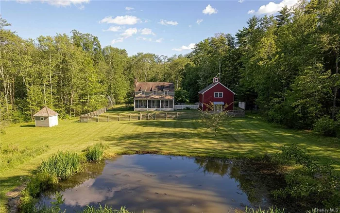 Tucked away on one of Stone Ridge&rsquo;s finest roads, this storybook Colonial is a perfect blend of classic elegance, modern comfort, privacy and convenience. Enjoy all the beauty and amenities the Hudson Valley has to offer then retreat to peace and serenity.   Exquisitely designed and meticulously maintained, this 2, 000+ sq ft home is a masterpiece of classic architecture with modern functionality. The thoughtful layout is perfect for entertaining and everyday living. The living room boasts a cozy fireplace and elegant built-in bookcases, while the formal dining room sets the stage for memorable gatherings. On the first floor, you&rsquo;ll also find a well-equipped kitchen with soapstone counters and a convenient powder room. Ascend the stairs to discover a private haven with three bedrooms, including a luxurious ensuite primary bedroom. French doors open out to a screened porch, which offers a tranquil escape and a lovely view of the pond, surrounding woods, and stone walls. Fully fenced, the backyard provides a safe haven for pets. Relax on the expansive bluestone patio. A separate two-car barn garage with a spacious second floor provides endless possibilities for a studio, workshop, or additional storage. An adorable garden shed and a whole-house Generac generator add to the convenience and charm of this exceptional property.  8 minutes to shopping and dining in Stone Ridge, 13 minutes to Inness and the community it offers, and 25 minutes to Kingston and New Paltz.