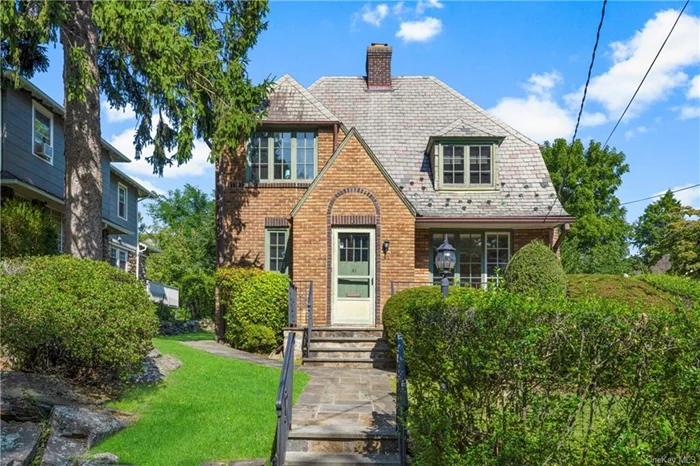 Welcome to 51 Cooper Lane! This lovely, inviting brick home with a slate roof has wonderful curb appeal! Located within a short walk to the Larchmont train station, Village, shops, restaurants and parks and near Murray Avenue School, you can make this bright, charming home your own. The entrance features a vestibule and powder room. The spacious living room with wood-burning fireplace leads to the sunny playroom/den. The ample dining room opens to the eat-in kitchen and features a door to the deck. The second floor offers 3 bedrooms, a hall bath and a walk-up attic. The basement has the laundry, utilities, and excellent storage space. Enjoy the outdoors in the sunny, level backyard - perfect for entertaining, gardening, playing or just relaxing. This wonderful Larchmont home with central air, gas heat, and hardwood floors is the perfect place to call home!