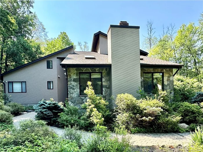 This custom built, modern, and contemporary home sits on 2.6 private acres in the Cornwall Central School District and is unique and very private. You&rsquo;ll be impressed by an airy sunken living room with high ceilings, oversized windows framing a wooded view, and a wood-burning fireplace. The updated kitchen has double ovens, Viking range, refrigerator, dishwasher, a microwave, built-in wine cooler, custom granite prep and breakfast bar, and granite countertops. The 1st floor continues with the master suite connecting an amazing primary bathroom highlighted by an oversized whirlpool tub and separate shower. The walk-in closet is designed to allow different combinations of hanging, shelving, and cabinets. This open floor plan spotlights a formal dining room with hardwood and natural stone flooring. Watch the seasons transform from the fully enclosed sunroom. Up the floating staircase, you&rsquo;ll find 3 large bedrooms, 2 separated by a Jack and Jill bathroom, a bonus/playroom, and the laundry room. Outside are newly renovated wraparound multi-level decks, an in-ground fire pit, flat and level grassy yards, mature gardens, and several storage areas. The 2-car garage has 12 ft. ceilings and a massive paved driveway to easily park boats, RVs, and other vehicles. Roof replaced in 2021, boiler replaced in 2023. HOME WARRANTY included. With acceptable offer, sell will give $5, 000 for window replacements