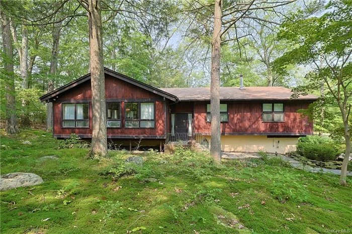 TUXEDO! MID-CENTURY MODERN! Located in the Maplebrook area nestled within the beautiful mountain scenery, this 4 Bedroom, 3 bath home is set on a private 1.3 acre private lot. The spacious home features an ENORMOUS GREAT ROOM with SOARING CEILING, EXPOSED BEAMS, HARDWOOD FLOORS and MASSIVE FIREPLACE! A perfect home for entertaining guests or enjoying a quiet evening relaxing. The large windows throughout the house provide abundant natural light and showcase the beautiful surrounding area. There is a large outdoor deck, formal dining and oversized primary bedroom with two massive closets. While the home needs updating, its POTENTIAL IS LIMITLESS and a perfect canvas for your personal touch. With its prime location and distinctive style, this property offers an exciting opportunity to create your dream home. The walkout lower level adds versatility and easy access to the outdoors and the 2-car heated garage. This home seamlessly blends practicality with comfort, making it an ideal choice for modern living. Easy access to NYC, Tuxedo Schools.