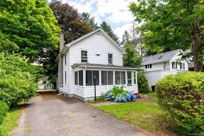 This charming vintage two-story home, nestled in the heart of Red Hook Village, seamlessly blends historic character with modern amenities. Bathed in natural light, the interior boasts beautiful hardwood floors and period architectural features throughout. The main level includes an open-concept living and dining area, along with a practical country kitchen. Additionally, there&rsquo;s a versatile bedroom/office with a zero-clearance walk-in shower, complemented by a handicap ramp for easy access if needed. Upstairs, you&rsquo;ll find a large bedroom with ample closet space, two medium-sized bedrooms with custom built-ins, and a bright full bath. The private backyard offers a serene retreat, ideal for gardening or relaxation, while a sweet enclosed porch invites you to spend leisurely afternoons with a cup of tea or a good book. Located within walking distance of the village&rsquo;s shops, cafes, and community events, this home provides a unique opportunity to enjoy a quaint, relaxed lifestyle with the convenience of modern living. It&rsquo;s just 15 minutes to Amtrak and is nearby the Bard shuttle route.