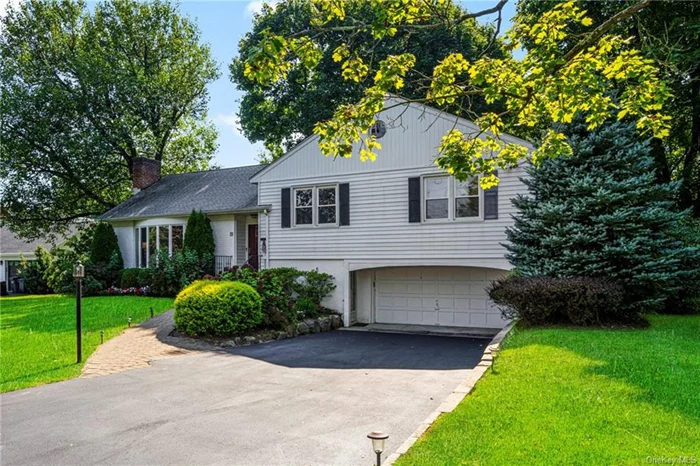 Discover this inviting split-level home, featuring 3 bedrooms and 2 baths, perfectly designed for comfortable living. The finished full basement offers additional space for a variety of uses, while the screened-in porch provides a tranquil spot to enjoy the outdoors year round. With a spacious attic boasting ample storage, you&rsquo;ll have plenty of room for all your belongings. The two-car garage adds convenience, and the mature landscaping, complete with a sprinkler system, enhances the home&rsquo;s curb appeal. Stay cool in the summer with central air conditioning and cozy up in the winter by the wood burning fireplace. This home has everything you need for relaxed living in style!