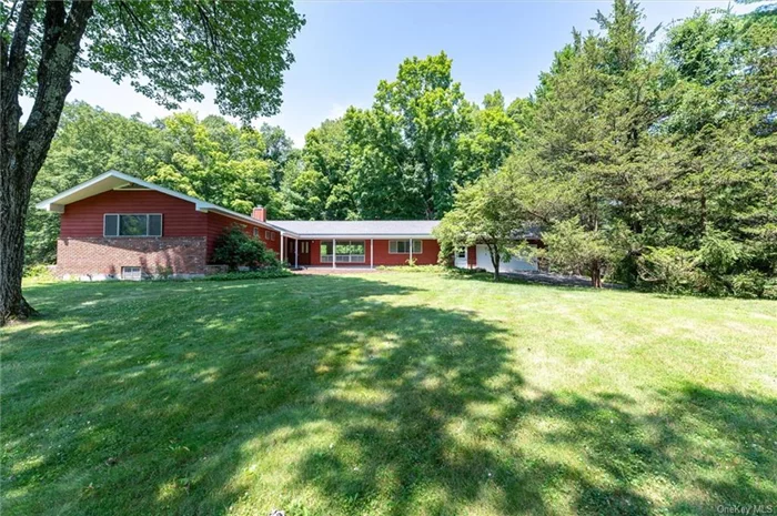 Welcome home to 32 Cross Pond Rd, situated on a stunning, level lot reminiscent of park-like serenity. Nestled in Pound Ridge with John Jay Schools, this exquisite ranch-style home exudes modern sophistication. Its expansive, bright, and airy spaces are accentuated by abundant glass, offering picturesque views of the surrounding grounds. The open-concept living areas are ideally suited for entertaining, featuring vaulted ceilings that enhance the sense of light and space. Updates include a new roof, a spacious 2-car garage, and a sizable basement, providing ample room for customization and expansion. Truly a gem with limitless potential.