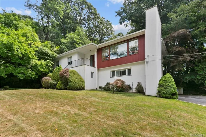 Mid-century modern beauty set on landscaped, tree-lined property. This home features an open floor plan and has been updated. Exceptionally spacious living room with walls of windows, a cozy wood-burning fireplace and hard-wood floors opens into the dining area and connected office or den. An updated kitchen with a breakfast bar is appointed with hardwood cabinetry, granite counters, stainless steel appliances and direct access to the stone patio and green space. There are three spacious bedrooms and an updated full bathroom located on the other side of the main level. Downstairs features a large recreation room with full sized windows, an additional den/office, full bathroom, laundry area and great storage. This roomy rental home is close to all, offering a relaxed and contemporary lifestyle for you to enjoy!