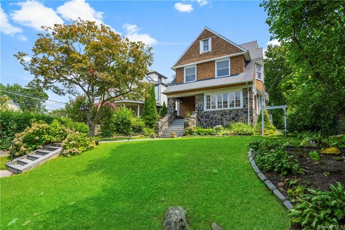 Elegance and charm awaits you at this side hall Colonial in New Rochelle&rsquo;s Historic District. The welcoming stone porch beckons you to enter this captivating 3918 sq. ft. 7 bedroom, 2 bathroom (plus 2 powder rooms) home located on 0.23 of a lush acre with gracious plantings and a lovely arbor. The entrance foyer/receiving room leads to the huge living room (358 sq. ft.) with a pellet fireplace, a beautiful dining room with oversized leaded glass windows, wood beamed ceiling and wood burning fireplace, a powder room, and you will love the 800 sq. ft. Great Room with its custom crafted cathedral wood-beamed ceiling, a Bose speaker system w/built-in speakers, gas fireplace, beautiful hearth, granite counters, wine refrigerator, comfy window seating, beautiful custom crafted cabinetry (did I mention the specialized warming drawer adjacent to the dining room), cabinets galore, office area and easy access to the stone terrace, garden and garage. The winding staircase takes you up to four bedrooms on the second floor (there is a back staircase also), a Jack & Jill powder room. a hall bath, and the third floor has yet another 3 bedrooms and hall bathroom. The floors have been refinished and gleam, the house has been freshly painted on the first and second floors. There are community red clay tennis courts & just a 30 minute commute to NYC. Close to fine dining and our wonderful art galleries too. Low taxes. Welcome home!