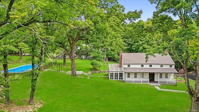 Welcome to 420 Nanny Hagen Road, a magnificent and completely renovated 18th-century farmhouse colonial in Thornwood, NY. This 4-bedroom, 2.5-bathroom, 3200 square foot home masterfully blends historic charm with modern luxury. Nestled on an estate-like property adjacent to over two thousand acres of reservoir and forever dedicated conservation land, this home offers unparalleled privacy and natural beauty. Cross over your own stone bridge to reach this unique residence, rich with history and visited by George Washington during the Battle of White Plains. The meticulously restored home features original pre-revolutionary exposed chestnut beams and porcelain knobs, combined with contemporary amenities like a professional chef&rsquo;s kitchen, a wet bar, and a built-in wall speaker system. The open-concept floor plan ensures a seamless flow throughout the home. The primary suite boasts a luxurious bath, a large walk-in closet, and custom cedar built-ins. Multiple second-floor balconies, a 300 square foot screened-in porch with a double-sided fireplace, and extensive bluestone patios provide ample outdoor living space to enjoy the serene surroundings. A 40-foot in-ground pool adds to the estate&rsquo;s allure, making it perfect for entertaining or relaxing. Modern touches, such as the screened-in porch, ensure comfort while maintaining the property&rsquo;s historic charm. Located in the sought-after Mount Pleasant school district, 420 Nanny Hagen Road offers a one-of-a-kind living experience where you can enjoy the views and sounds of nature from every corner of this exquisite property. Don&rsquo;t miss the opportunity to own a piece of history, beautifully restored and ready for modern living.