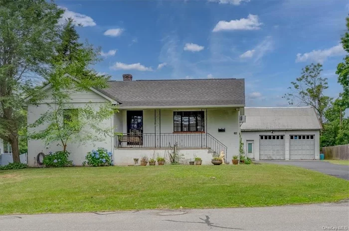 Perfect property for contractors, boat owners or anyone in need of an oversized garage! The house is a 1043SF 2bd/1ba ranch with an enclosed porch. The lower level is also 1043SF with a summer kitchen, bathroom and recreation room. The lower level will be legalized prior to delivery. It is in the process of legalization now! This property comes with a 1050SF 2car garage with high ceilings, small office and storage loft. The toilet in the garage will NOT be legalized prior to delivery. The lot is 100 x 143 with a driveway for several cars. Wonderful flat property! PROPERTY SELLS AS-IS!