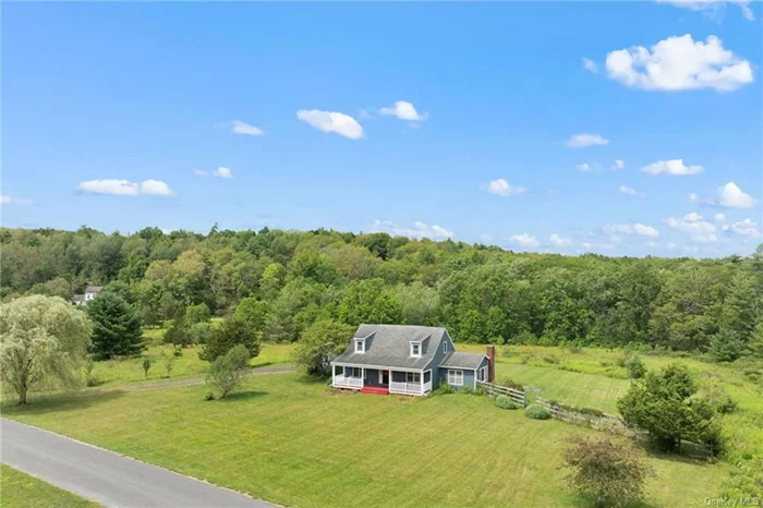 Nestled on a tranquil country road in the charming town of Kerhonkson, awaits a picturesque home with 3 bedrooms, 2.5 bathrooms, and an office space, all set on an expansive 3.6 acres.  Approaching the front door, you&rsquo;ll be greeted by a captivating covered porch, an idyllic spot for unwinding with a good book. Step inside to discover a thoughtfully designed entrance with a convenient coat closet and space for an entryway bench or table, creating a warm and inviting welcome.  The dining room and kitchen are bathed in natural light and offer sweeping views of rolling hilltops. Recently renovated, the kitchen boasts sleek upgrades, while the entire home showcases elegant hardwood flooring. The sunken living room features extra wide pine flooring and large windows, warming the space with radiant natural light.  The primary bedroom, located on the first floor, offers the epitome of comfort with its en suite full bathroom. Adjacent to the living room, you&rsquo;ll find an additional office or bedroom, providing flexibility to suit your needs.  Ascending the stairs, a cozy reading nook awaits complete with a private window. Two generously sized bedrooms on the second floor share a full bathroom and each provide ample storage space with separate closets. In addition to the bedroom closets, there are two additional separate storage closet at the top of the stairs.   Step outside to the sprawling backyard with a private deck ideal for outdoor gatherings and entertainment. Pending approvals, there is ample room to add a swimming pool or even an additional dwelling unit (ADU). Completing this incredible property is a two-car garage with additional storage shelving, providing convenience and organization.  Discover the allure of Hudson Valley living and make this serene retreat your own!