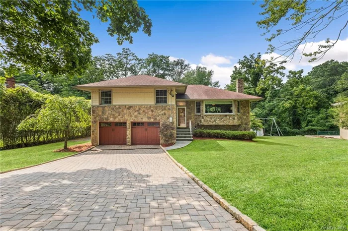 Welcome home to this bright and spacious 3 BR/2.5 bath split-level home nestled on over a 1/3 of an acre of gorgeous private property in the peaceful Worthington neighborhood of Greenburgh. This immaculate and beautifully maintained home offers an abundance of natural light and a thoughtful layout. The main level features an inviting entry hall, eat-in-kitchen, ample storage, plenty of space for food prep and a door that leads to the deck, where you can relax and enjoy that morning coffee or tea. Entertaining is a breeze with a separate dining area off the kitchen and seamless flow into the living room. Up just a few steps you&rsquo;ll find 2 bedrooms, a full bath with double sink vanity, primary en-suite with great closet space and a full bath- a space that truly makes for a nice relaxing retreat! Be amazed as you make your way downstairs to find a conveniently placed powder room, centrally placed before heading to the lower level where you&rsquo;ll be pleasantly surprised as you enter the huge entertainment room with high ceilings, slider out to the patio and a tranquil yard for great party fun! Completing the lower level is a custom tile feature wall, expansive entertainment area with wine fridge, built-in cabinetry, a dedicated work/office area, additional storage space, mechanical room and also a laundry room. This home also features a 2 car garage, multi-car driveway and is in a convenient central location making this a must see property! Don&rsquo;t miss the opportunity to call this amazing home your own!!