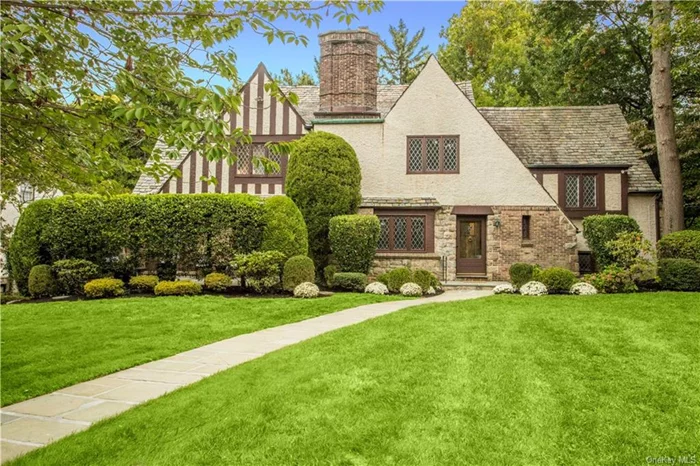 Chockfull of character and charm, this stately six bedroom masterpiece graces over a third of an acre on one of New Rochelle&rsquo;s most coveted streets. With magnificent curb appeal and stunning original architectural details perfectly paired with modern updates, its easy to fall for this beauty. The phenonmenal floor plan features a grand living room with stone fireplace, sunroom with door to inviting private patio, large formal dining room, eat-in kitchen with extensive cabinets and butler&rsquo;s pantry, and a truly charming family room. Enjoy four bedrooms all on one level including a large primary with ensuite bath, an oversized bedroom with double closets and a bedroom with steps to attic with untapped potential. Two additional bedrooms with full bathroom on a private wing, ideal for guest suite and/or home offices. Plus, the basement features extensive bonus space. This special haven boasts a beautiful flat backyard with mature plantings and privacy. Near shopping, schools and worship.