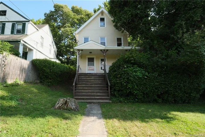 One look at this three bedroom, one and one half bath colonial style home, circa 1906 with its good size rooms, hardwood floors, country ambiance with all the conveniences of the city, you will realize that in Westchester County, this is definitely a best buy. Shine up this older home; loved by one family for 56 years,  and watch it sparkle. Sweeping front lawn leads to a wrap around front porch; rocking chair ready. Front entry to foyer, living room, dining room with original built in cabinet, slider to concrete patio and Dutch door out to wrap around porch. There is a powder room on this level. The country eat in kitchen has a door out to patio and back yard. A mature, spectacular and beautifully formed sycamore tree with a spreading majestic canopy shades the whole back yard. First level, 620 sq ft. Upstairs to three bedrooms, full hall bath; 544 sq ft,  Hallway has stairs leading to a partially finished and partially heated attic with good, useable space.; 213 sq ft. Downstairs to unfinished, full basement; 502 sq ft. with 2 newer Roth oil tanks; each tank is 275 gallons; mechanicals, laundry and door out. Original wood floors, moldings, door knobs and electric back plates. Square feet of home does not include basement or full attic. There is i ac unit. Furnace serviced 7/2024. Roof is 4 years old. Roof information as completed in proposal form attached in documents. There are newer vinyl windows. Approximately $4800 in yearly heating costs when original owners resided in home; electric costs approximately $1200 (circuit breaker panel). Certificate of Compliance to legalize propane tank and gas line used for the dryer is attached in documents. Star, if applicable is $1878. House is part of an estate and is, sold, as is, where is. Rooms are field measured but measurements are considered approximate. This is Everything we know. Seller will not consider any offers made prior to potential buyers&rsquo; physically viewing this property