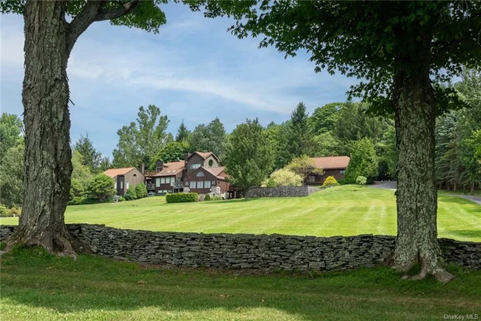 JUST LISTED in the CATSKILLS: Encompassing over 47 ACRES, 94 Overlook Drive is a truly luxurious estate comprised of a show-stopping main residence of 3 bedrooms, 4-1/2 bathrooms and over 3, 800sf, a primary 1, 256 sf 3-car heated garage, a 520 sf guest house/gym, a 400 sf cottage and two additional utility buildings/garages and home to a monument memorializing a Revolutionary War soldier (1764-1847). Designed to the specifications of owners Carol-Ann and Lou Bloise, architect Lee Friedman enhanced additions to this eclectic contemporary home set on 25 acres of pristine, private and manicured perfection, the property is replete with stone walls and rolling, verdant grounds in the Town of Andes. This rare parcel of preserved natural beauty is the epitome of Upstate New York, Catskill&rsquo;s living, and, just 2.45 hours northwest of New York City (amazing drive along the Hudson River). Striking, breath-taking, long-range MOUNTAIN VIEWS from practically every room. Entering through the 3-story tower, you&rsquo;ll find an open floor plan with walls of windows overlooking the grounds. Dining area with fireplace, updated eat-in-kitchen with new state of the art stainless-steel appliances and opens to a rear patio with outdoor grilling/eating space and abundant built-in seating. Numerous wooden walkways, decks and outdoor seating areas abound. There is a main level bedroom with spectacular full bath. Step down to the living room with fireplace or enjoy the library with fireplace and opens out to a deck overlooking the estate. Off the kitchen is a staircase down a stone-lined wall to a media center with fully stocked bar, dishwasher and refrigerator. Take advantage of the EuroCave temperature controlled 200-bottle wine cooler for entertaining. The primary ensuite bedroom upstairs includes a 6&rsquo;x6&rsquo; tiled shower and separate sitting area and an additional bedroom with that wow circular window offering unparalleled mountain views. Additional structures include a guesthouse/gym recently updated with siding and windows and features a curved wall bathroom, a steam shower and sauna. Most impressive are the grounds which include a koi pond with seating to enjoy the views, numerous manicured specialty gardens to explore, 2 additional garage utility buildings and a 400 sf 2-story cottage. Secreted away is a shooting range and the revolutionary war monument (Waterbury Cemetery) for Daniel Waterbury. Private, secluded, quiet rural area, minutes to amenities in Andes. An incredible opportunity awaits you.