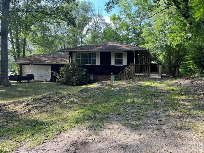 Diamond in the rough! This classic ranch is need of your magic touch. Fabulous layout! Potential to make this a handicap accessible home with ramp entry already present. This cedar sided splanch/ranch is ready for a makeover. Three bedrooms plus two full baths, two car garage and huge unfinished basement space on a half acre. Town of Warwick with Greenwood Lake and Warwick Schools. More pictures to come. Enjoy the quiet on this private road. Local attractions include: hiking, Greenwood Lake for boating, swimming and fishing, wineries, breweries, skiing, shopping and nearby local Greenwood Lake and Warwick villages.