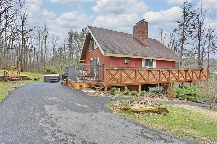 A-Frame home in the town of Wallkill within the Minisink School District. The home is nestled amidst 1.2 acres of serene woodland and offers lots of natural lighting, vaulted ceilings, along with charm and privacy. A large wrap-around deck hugs the perimeter of the home, providing ample space for outdoor relaxation, entertaining, and soaking in the sights and sounds of nature. Inside enjoy the rustic beauty with breathtaking views of the floor-to-ceiling windows. The updated kitchen and bath in 2023 give it a modern touch. Other modern conveniences are smart thermostats and well water filtration system. A three season sun room with floor to ceiling windows adds to the charm of this house along with a bedroom on the main floor. Heading upstairs to the primary bedroom, you&rsquo;ll discover exposed wooden beams providing a comfortable and relaxing space. On the bottom level you will find a living area with an additional fireplace. A bedroom on the lower level, laundry area and walk-out provides a perfect private space. Outside, explore with winding paths leading through the woods and opportunities for outdoor recreation with the above ground pool just steps from your door and a shed that provides your outdoor storage. Potential for purchase of the furniture. In addition, the property is currently being used as a successful AirBnB providing extra income. Schedule your showing today!