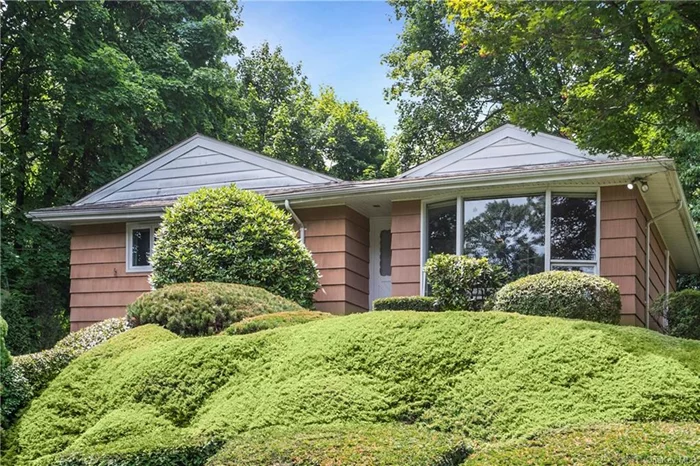 Superlative, turn-key mid-century style ranch with tree-top views in the desirable Village of Ardsley is a veritable zen sanctuary. 1, 748 SF of divine living space is comprised of 1299 SF on main level, including a beautiful open-concept living area, and 449 SF walk-out finished lower level. Arresting upon entry, front to back sight lines from the verdant plantings in front to the picturesque backyard bring nature indoors, and rich wood plank ceilings top the living room and dining area, setting an alluring ambience. Starting with the large bay window in the living room, the lush shrubbery provides a natural privacy barrier for the main living space, the heart of the home. From the living room flows the dining area with large picture window overlooking the park-like grounds. In turn, the dining room opens to the spectacularly renovated kitchen with quartz counters, subway tile backsplash, attractive pendant lighting, stainless steel oven/range and refrigerator, and large bay window. Nature envelops you! The primary bedroom has double exposures and lovely, updated ensuite full bathroom with storage space aplenty. Two nicely sized family bedrooms and tastefully updated hall bathroom complete the main level. Found below is a walk-out lower level featuring a spacious family room with a convenient mud area for entering from the garage or street, large laundry room, storage room, and access to the one-car garage. Move right in and enjoy unparalleled easy, serene living. Taxes are prior to STAR.