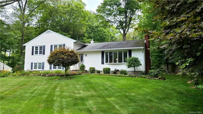 Welcome to 35 Doran Drive located on the cul-de-sac in the sought after Pinewood Knolls, a sub-division in the heart of Hopewell Junction. This property is just minutes to the Taconic, Town Center (shops and restaurants) and Schools. In this 4 Bedroom, 3-level Split home there are Hardwoods on the 1st floor, Living Room with wood burning Fireplace opens to the formal Dining Room. Eat-in Kitchen with Stainless Steel appliances. The 2nd level offers all 4 Bedrooms with Hardwoods under the carpeting. The Master has a renovated En-suite Bath and the main Bath has a new Vanity. The lower level offers the Family Room with a Sliding Glass Door to the property, Laundry with Washer and Dryer and access to the 2 Car Garage. Updates include the Vinyl Siding, Windows and Furnace. Municipal Water, 3 Zone Oil Heat, Wall and Window A/C Units, 200 AMP Service. All this on a landscaped Acre. Enjoy relaxing in the Three Season Screened-in Porch viewing the beautiful gardens.