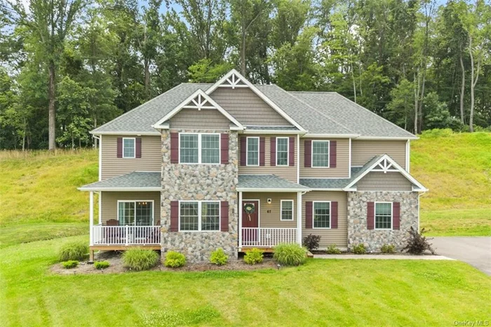 Excellence at the peak of the Meadowbrook Estates in the highly sought-after Cornwall Central School district. This four-bed, three-bath Colonial home was built in 2022 and is close to every amenity the Hudson Valley offers. The clean, classic elegance of the neutral palette with gleaming hardwood floors and bright, natural light make this home an easy choice to fit your style. Set at the top of the development, you will enjoy beautiful valley & mountain views from most windows. Enter into an inviting open living area with a fireplace, a custom eat-in kitchen with granite countertops, an apron sink, and a center island with custom lighting and stainless steel appliances. A formal dining room and powder room complete the first floor. The primary bedroom on the second level comes complete with tray ceilings, two closets, one walk-in, and an en suite bathroom with a double vanity, soaking tub, and walk-in shower. The second floor also has three large bedrooms, a full bath, and a laundry room. The unfinished basement is a blank slate to make your family room, bar, movie theater, gym, etc. The property also includes an attached 2-car garage and beautiful landscaping on a 1/2 acre lot. All this is being offered in the highly sought-after Cornwall School District. Location: Perfectly located for the commute, only 5 minutes to the Salisbury Mills train station, 10 minutes to Stewart International Airport, 15 minutes to West Point, and one hour to NYC.