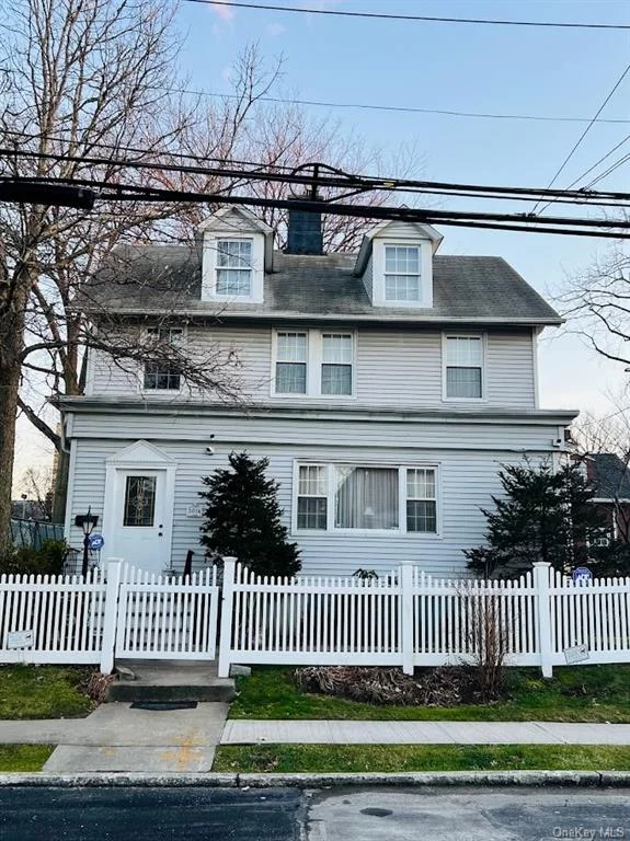 This charming corner property is located in the Pelham Bay area between Hobart and Crosby Avenue. Enter through the main entrance into the front hallway lit by sunshine from the many windows surrounding each room. First floor features living room, dining room, sitting room/bedroom, laundry room, a full bathroom and an eat in kitchen with sliding glass doors leading onto the patio. Second floor features three bedrooms, an extra room currently being used as a home office, a full bathroom and stairs leading up into a full unfinish attic for plenty of storage space. For additional storage there is a full unfinished basement with a storm door leading into the backyard.  This property has both a backyard and a huge side yard with a well maintained lawn for endless possibilities. Great fenced in play area for the kids and pets and ideal for family gatherings. Property contains 2 separate gas meters and 2 electric meters ready for conversion to multifamily if buyer desires. Call today to schedule a private showing.