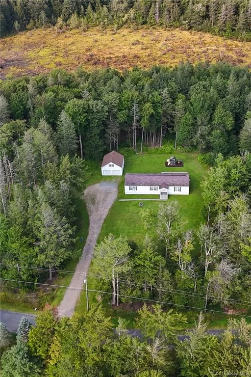 3 bed 2 full bath ranch home sitting on over 4 acres in the town of Neversink for sale! Almost 2, 000 sq ft. with an open floor plan. This property offers great privacy with a tranquil setting. Features include an open living room and kitchen, eat in kitchen with an island, stainless steel appliances, tons of natural lighting, spacious bedrooms, master bedroom and bath, with a walk in closet. A great feature is the two car detached garage with tons of storage space. The private back yard overlooks the woods to really embrace the nature. Oversized back deck for great entertaining! Great for a full time home or a weekend retreat. High speed internet, very low taxes and Trivalley Schools. Less than 2 hours from NYC. Close to many local attractions such as Bethel Woods Center For The Arts, Resorts World Casino, Kartrite Water Park, and many great local restaurants and breweries! Great hiking near by. Near two reservoirs for great fishing and tons of state land for hunting. Come see today!