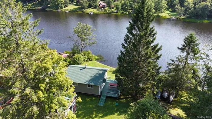 No Frills, Low Bills!! This lakefront cottage on Lake Muskoday will not break the bank but gives you all of the associated stress relief of a quiet waterfront home. Muskoday is a non-motorboat lake just minutes outside of Roscoe, NY that is great for fishing, swimming and just plain relaxing. This one room cottage is open concept with a sleeping area, dining area, kitchen and living areas overlooking the lake. The bathroom has an incinerator toilet and not a conventional septic system. The gray water from the kitchen does drain into a functional drywell however. There is also an outhouse, a tool shed and another storage shed. At a great price and low taxes, you can start enjoying the simpler things in life. Schedule your tour today.