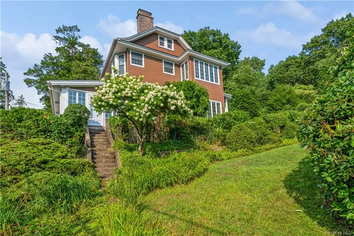 This quintessential Hastings on Hudson 1910 Riverview Manor Colonial enjoys wonderful privacy and beautiful year-round Hudson River views. As soon as you step into the large enclosed front porch w/three exposures and lovely River views, you will feel a sense of home. Three sets of French doors open to the main home where you will find abundant sunlight, high ceilings and striking architectural details. Living Room and Library both feature fireplaces, a formal Dining Room boasts a leaded glass cabinet and window seat, the Butler&rsquo;s Pantry leads to the Kitchen and Mudroom and there is a door to the covered patio adjoining a second large patio and yard. This floor also offers a powder room and bonus room perfect for Family Room, Home Office or Breakfast Room. Upstairs you will find a Primary Bedroom w/FPL, three additional Bedrooms, two full Baths (one ensuite) and two enclosed porches. The treetop vistas evoke a serene getaway while you are in a vibrant Riverfront community close to NYC. New roof 10/22 - New siding 2008 - New Windows 2009-2011.