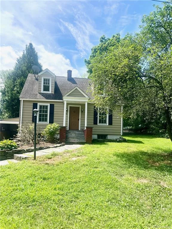 This 1920s charming Cape Cod style home in historic Hyde Park, Hudson Valley, New York, offers a cozy and inviting living space with a nice flow. The first floor features a living room, dining room, kitchen, and a sunroom that overlooks the backyard, perfect for year-round enjoyment. The second floor comprises two bedrooms and a full bathroom. Outdoor enthusiasts will appreciate the ample outdoor space and a deck for relaxing. The property includes a one-car attached garage and driveway parking. Ready for immediate move-in, this home allows you to add your personal touches at your own pace. Explore the rich offerings of the Hyde Park area from this sweet home. Sold as-is.