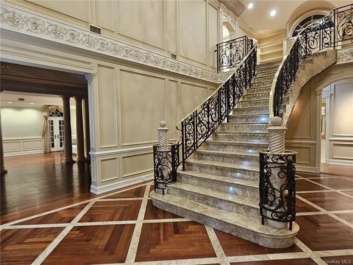 Imagine yourself in this mansion boasting 6bds/7bas with over 14, 031sqft of space. Starting with 8562 sqft of living space; meticulously designed for comfort and sophistication. As you enter through the grand foyer, be welcomed by a stunning marble staircase that sets the tone for the rest of the home. The formal living area features high-end molding and exquisite French doors. The heart of the home is the chef&rsquo;s kitchen, designed to impress with a massive island, custom cabinetry, and top-of-the-line stainless steel appliances. Ideal for entertaining, this space flows seamlessly into a gorgeous sun room. With its extra-wide sunroof, this room is perfect for relaxation or as an impressive dining area. The double king-sized retreat features a vaulted ceiling and an opulent walk-in closet. The master bath is a sanctuary with its marble finishes, double vanity, walk-in shower, and ornate soaking tub. Additional bedrooms are generously sized, offering ample space for family, guests, or your personal hobbies. The fully wooden lounge is an elegant space ideal for a bar, library, or office. For fitness enthusiasts or creatives, there&rsquo;s room for a home gym or dance studio, complete with a wall of mirrors. The basement/garage includes an additional 5469 sqft of space and the winterized garage with electric and A/C is included. With endless possibilities and unparalleled luxury, this grand estate is more than a property it&rsquo;s a lifestyle.