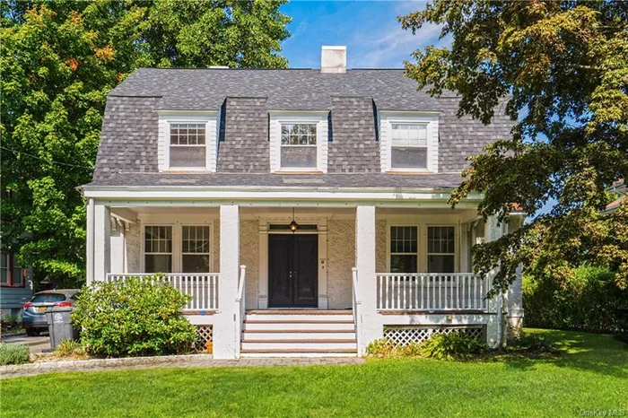 Situated perfectly on its lot, this classic front porch stucco colonial delights with modern upgrades while retaining old world charm. The beautiful double doors at the entry sets the stage as one enters into the foyer. The living room with fireplace and dining room are graciously sized. The separate den creates flexible space, perfect for a home office or library. The kitchen and powder room have both been renovated, allowing you to just move in and enjoy. Upstairs are 5 bedrooms, also with a renovated bath and two extra rooms on the third floor, also with a full bath. The yard is deep and flat, perfect for play space, pets or ample room for gardens. Located just minutes to downtown White plains, with its vibrant restaurant scene and shopping as well as Metro North. Live the good life. Welcome home!