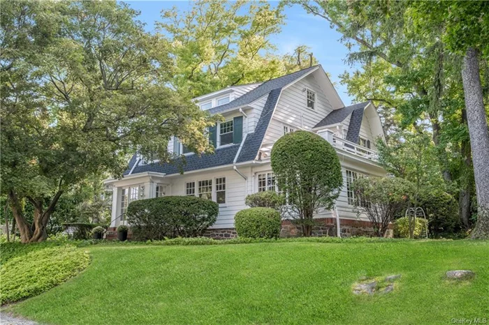 Step into this enchanting side-hall Colonial, nestled on one of the most picturesque blocks in the highly sought-after Pelham Heights neighborhood. Just a short stroll from the train station, schools, park, and town, this home offers both convenience and charm. The welcoming vestibule leads to a spacious living room adorned with coffered ceilings, a wood-burning fireplace, and a charming seated nook. The adjacent sunroom is perfect for a home office or den. The formal dining room connects to the kitchen, which opens to an outdoor patio and large side yard ideal for entertaining and outdoor activities. Upstairs, the primary bedroom features an ensuite bath and outdoor patio. Three add&rsquo;l bedrooms and a hall bath complete the second floor. The third floor offers two more bedrooms, a full bath, and ample storage. The lower level is ideal for a playroom, gym, or office. Lovingly owned by the same family for 90+ years, this home is now ready to welcome its new owner. Do not miss this one!