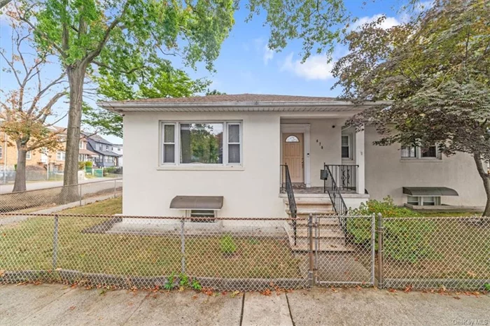 Welcome to this inviting, move-in-ready home in Throgs Neck, brimming with natural light and offering a wonderful balance of comfort and functionality. Enjoy one-level living with beautiful hardwood floors throughout. The first floor features a welcoming foyer that opens up to a large living room, perfect for entertaining or relaxing. The eat-in kitchen boasts abundant cabinet and storage space, providing plenty of room for meals and gatherings. The full basement offers a dedicated laundry area with lots of storage space. Situated on a desirable corner lot, this property also offers a fenced-in yard with a charming gazebo, ideal for outdoor relaxation, or entertainment. Additionally, this home includes a spacious 2-car detached garage, providing ample parking and storage. Updates include new roof in 2021, washer/ dryer replaced in Feb 2024. With its combination of practicality and charm, this light-filled and spacious home is a must-see! Don&rsquo;t miss the opportunity to make it yours today!