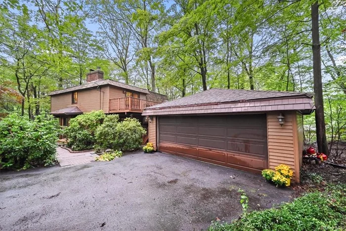 Welcome to Treetops. in Tuxedo&rsquo;s sought-after Laurel Ridge Community. Privately set behind a hedge of rhododendrons and laurel, this contemporary-style home takes full advantage of its Sterling Forest setting. Different levels give an open feel, featuring a vaulted ceiling over the main living space of the house, with large skylights for lots of light. The home offers balance with private cozy spaces: a main level sitting room with a brick wood-burning stove, a study with fireplace, and a private deck adjacent to the primary bedroom. Lots of space for entertaining with an upgraded kitchen and formal dining room. A large, screened sunroom offers beautiful views of the surrounding nature. A semi-finished basement offers even more options. The Laurel Ridge community has its own tennis/pickleball courts, ball field, and playground maintained by the Town of Tuxedo--no HOA fees. A short ride from the Tuxedo Park Train Station with train and bus service to NYC, only 40 miles away.