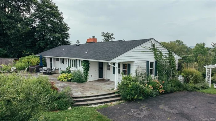 Orchard Hill is a spacious 1955 mid-century ranch home, with 270 degree views of the Rondout Valley. To the South, the Shawangunk Ridge and Sky Top tower are clearly visible from the property. To the north, the sprawling Stone Ridge Orchard&rsquo;s apple groves and pond. Turn westward and take in the sunsets that make this valley so magical over Mombaccus Mountain and Ashokan High peak.   The long driveway brings you up to this hillside oasis, with mature apple trees and lush perennial gardens surrounding the home. A sprawling bluestone patio with hot tub spans the length of the home, with doors from both sides of the kitchen and the primary suite leading outdoors.   The formal entrance of the home leads to a light filled living room, dining room, and den. The oversized country kitchen has entrances from the front hall, or directly into the dining room. To the right, find three generous bedrooms, including a massive primary suite. The home was originally four bedrooms, but one was redesigned into a primary bath fit for a king. Dual sinks, soaking tub, and elegant tile shower provide plenty of space for two. The hall bathroom also features two sinks and a large shower. The kitchen has its own powder room as well.   Open and spacious, the ranch style layout provides easy living. The den opens to the backyard, where you will find a hillside with apple trees and a mix of lawn and wild meadow. The 3.57 acre lot is spacious enough to provide privacy, especially with Stone Ridge Orchard behind. The sellers plan to adjust the lot line slightly to deed the road that passes through the Orchard back to that property, resulting in a minimal reduction in overall acreage.   The home has been fully vetted and approved as a short term rental by the town of Marbletown, but was recently rented on a long term basis for $6, 500 per month, so if investment is your goal, this property has significant income producing potential.   When it comes to location, this property simply cannot be beat. It&rsquo;s just under a mile to Stone Ridge Plaza with a grocery store, wine shop, pharmacy and more. Dining options abound, including Butterfield&rsquo;s at Hasbrouck House, Hash for amazing breakfast and lunch, and of course Ollie&rsquo;s Pizza, just 1.3 miles away in the heart of High Falls.   This home is just 7 minutes to downtown Rosendale, 20 to New Paltz or Kingston, and 10 minutes to Mohonk Preserve&rsquo;s Spring Farm Trailhead. Let the Gunks and the Sundown Wild Forest be your backyard, and don&rsquo;t sacrifice the conveniences of village life on your move Upstate. Orchard Hill truly has it all.