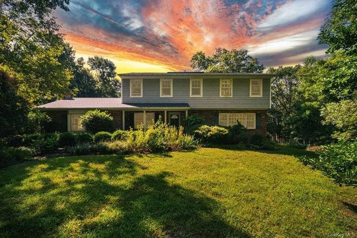 ENTER A 10 ACRE WONDERLAND OF BLISS! A Beautiful 4 bed 3 bath Colonial, surrounded by a fairyland of flowers, shrubs and a vegetable garden. A peaceful haven, set back in silence, privacy and peace. This magical property hosts 2 large living rooms, 1 could be a 1st floor bedroom. A roomy office, a stunning brightly lit sun room, plus an ornate powder room opposite a large laundry room graces the 1st fl. Gloriously featuring a big open kitchen with soap stone counter tops and sink, a stylish island flows into the dinning area and family room with stunning tiles around the cozy insert fireplace. Original hardwood fls throughout flow upstairs to a sunny landing. The large primary bedroom has beautiful views of 10 acres w a renovated ensuite bathrm. 2 big bedrms w good size closets, plus a sweet cozy bedrm next to a stylish renovated bathrm grace the 2nd fl. A huge 3 car garage! Generous back deck, w fairy walks to the stream. Close to Sugar Loaf! Elegance and style for days! Solar panels leased 2024, saves money! New roof and gutter guards 2023! Freshly painted in 2023. Septic cleaned 8/24. Warwick Schools, Easy NYC Commute. Welcome Home!