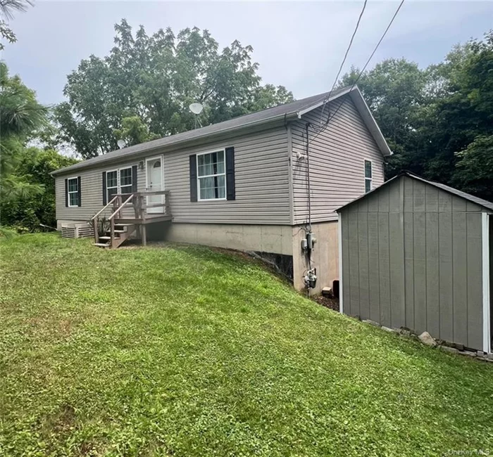 Set back in the tranquil outskirts of Walden, NY, this charming ranch home offers the perfect blend of seclusion and convenience. Located a short distance from the center of the village, and in the Valley Central school district, this 3 BR, 2 bathroom is lovingly maintained, and move-in ready! Check out this beautiful kitchen featuring granite countertops, stainless appliances, and an oversized island. Hardwood floors and a ton of natural light give this house a cozy feeling of home. Bathrooms have been updated. Bedrooms are good sized rooms, with large closets. Full walkout basement offers a lot of additional space. The 1-car attached garage offers the option to park out of the elements, or additional storage. And this 2-tiered deck down to the swimming pool is an awesome outdoor space to host parties, BBQ&rsquo;s, or just relax at home! Priced to sell, please call with any questions.  Access house via Grandview Terrace off Rt 52, next to Dollar General (unpaved road, looks like driveway)